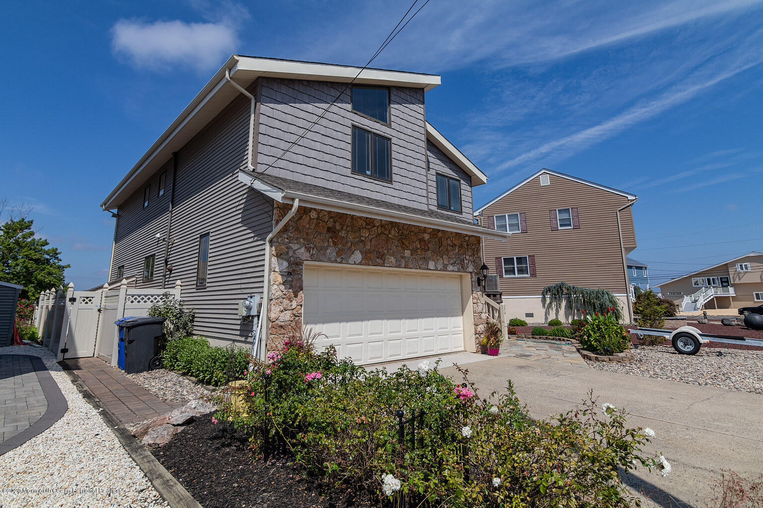 356 Silver Bay Road Toms River, NJ 08753 - Photo 4 of 41 a front view of a house with a yard and garage