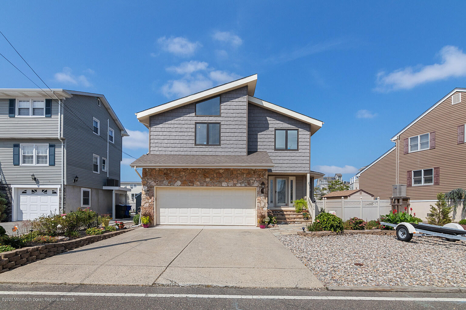 356 Silver Bay Road Toms River, NJ 08753 - Photo 5 of 41 a front view of a house with garage and parking