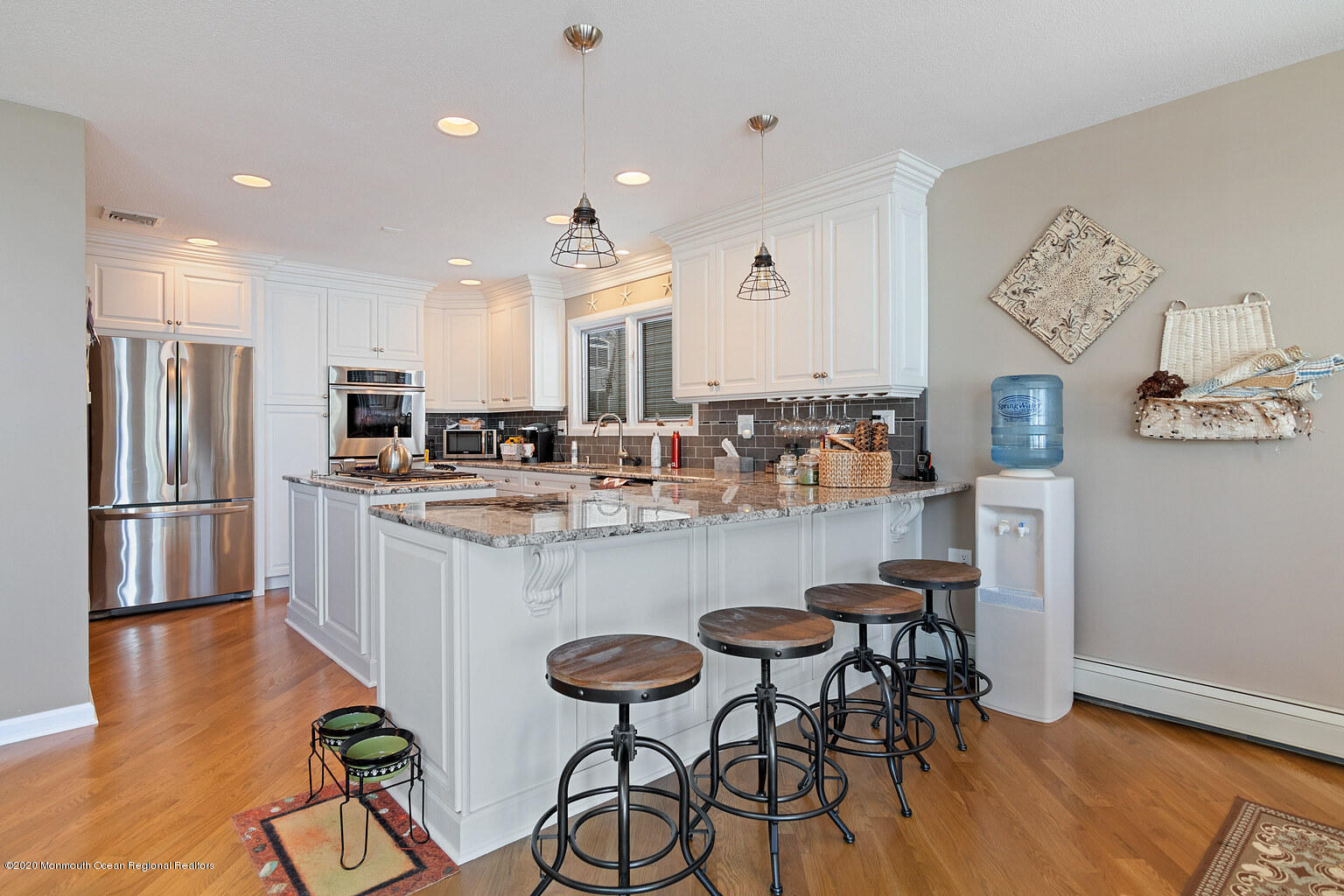 356 Silver Bay Road Toms River, NJ 08753 - Photo 9 of 41 a kitchen with stainless steel appliances granite countertop a dining table chairs refrigerator and sink