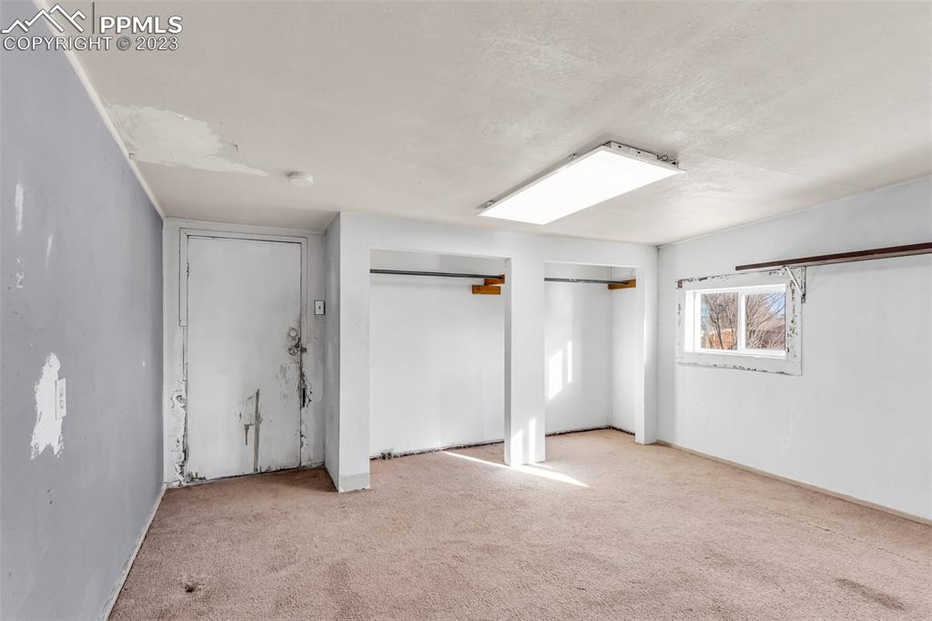 1417 2nd Road Pueblo, CO 81007 - Photo 14 of 32 a view of an empty room with a window