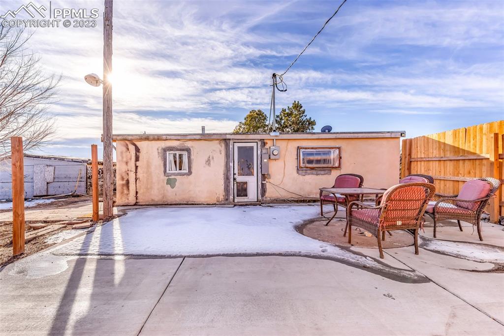 1417 2nd Road Pueblo, CO 81007 - Photo 18 of 32 a view of a chairs and table in the patio