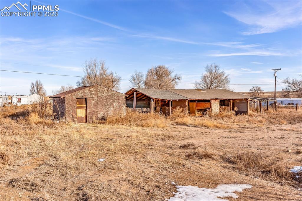 1417 2nd Road Pueblo, CO 81007 - Photo 20 of 32 a front view of a house with a yard