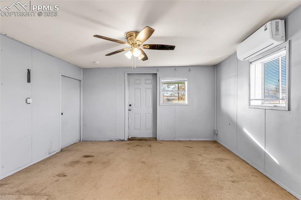 1417 2nd Road Pueblo, CO 81007 - Photo 4 of 32 a view of an empty room with a window