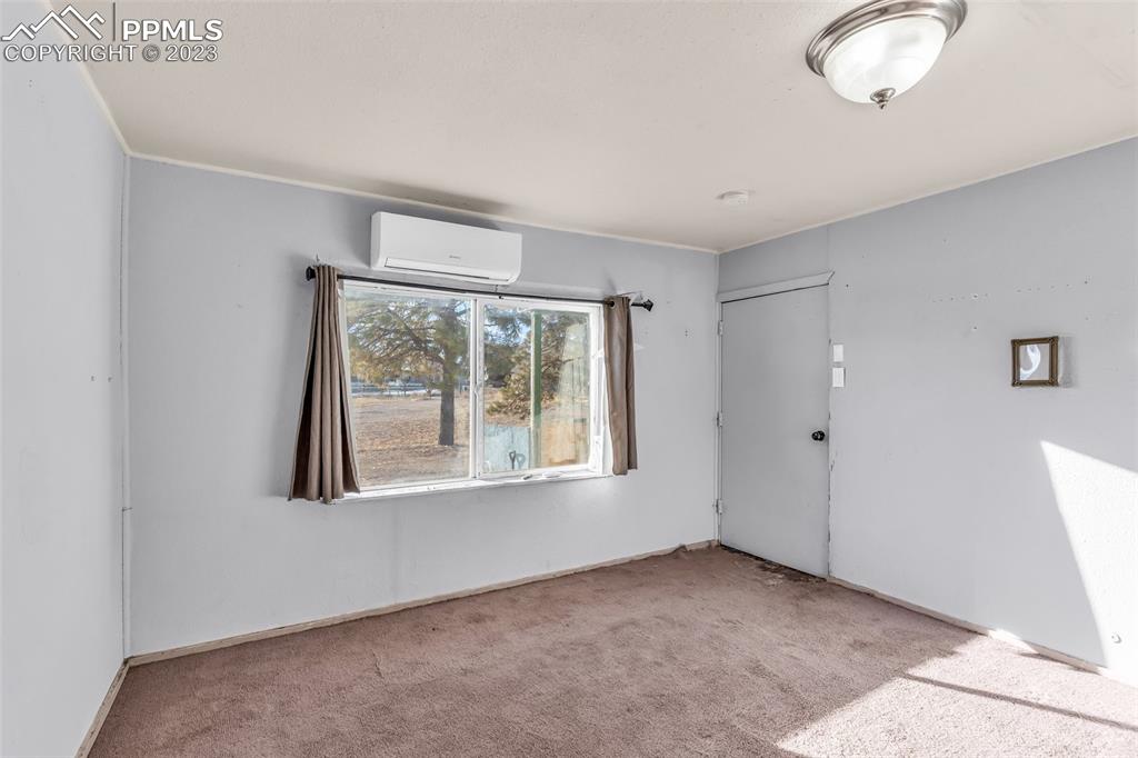1417 2nd Road Pueblo, CO 81007 - Photo 6 of 32 a view of an empty room with a window
