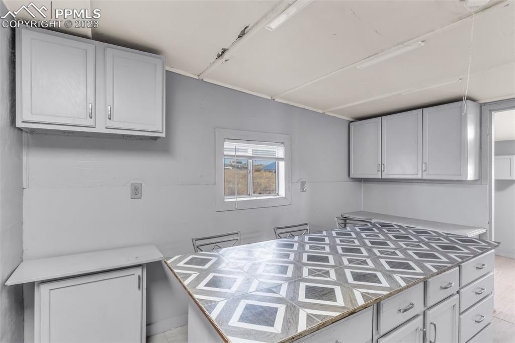 1417 2nd Road Pueblo, CO 81007 - Photo 8 of 32 a view of a kitchen with white cabinets