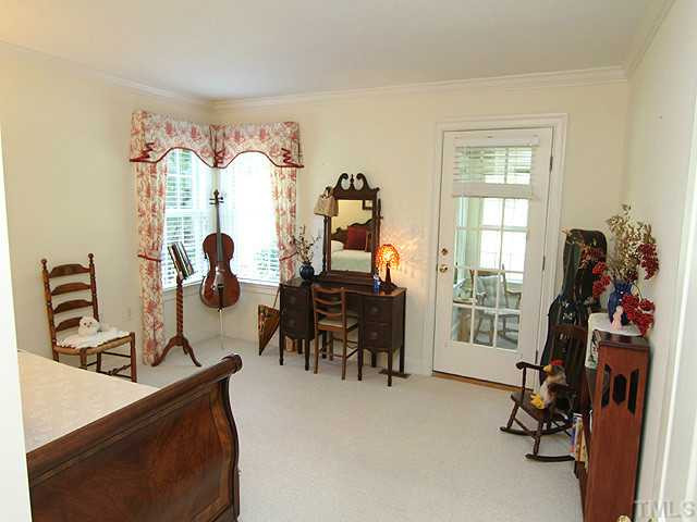 511 Mason Road Durham, NC 27712 - Photo 11 of 25 Both guest bedrooms have access to this cozy, bright sun room. This additional flex space can be used as private living space for out of town guests or a hobby/toy room for the children. Sun Room