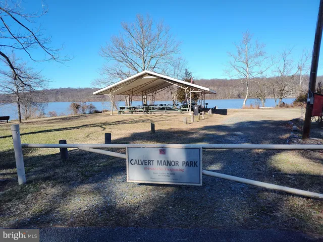 a view of a house with a yard covered with snow