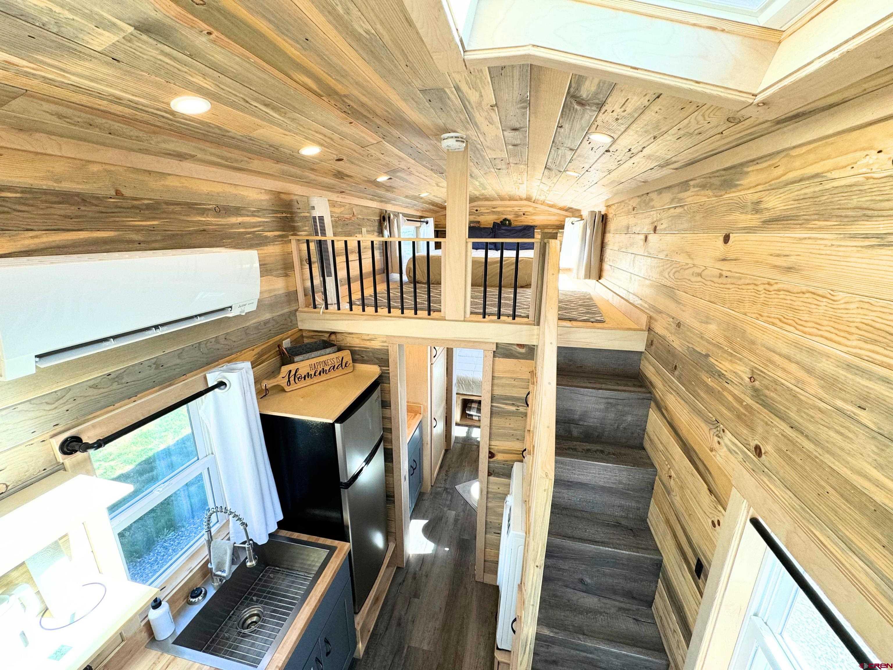22130 6850 Road, Unit 212 Montrose, CO 81403 - Photo 13 of 29 a view of entryway with wooden floor