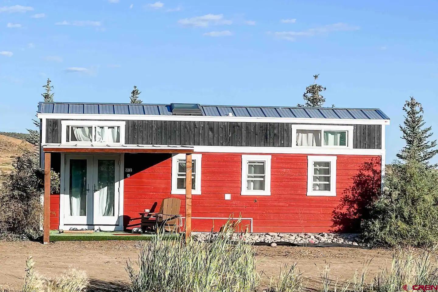 22130 6850 Road, Unit 212 Montrose, CO 81403 - Photo 18 of 29 a view of a house with a swimming pool