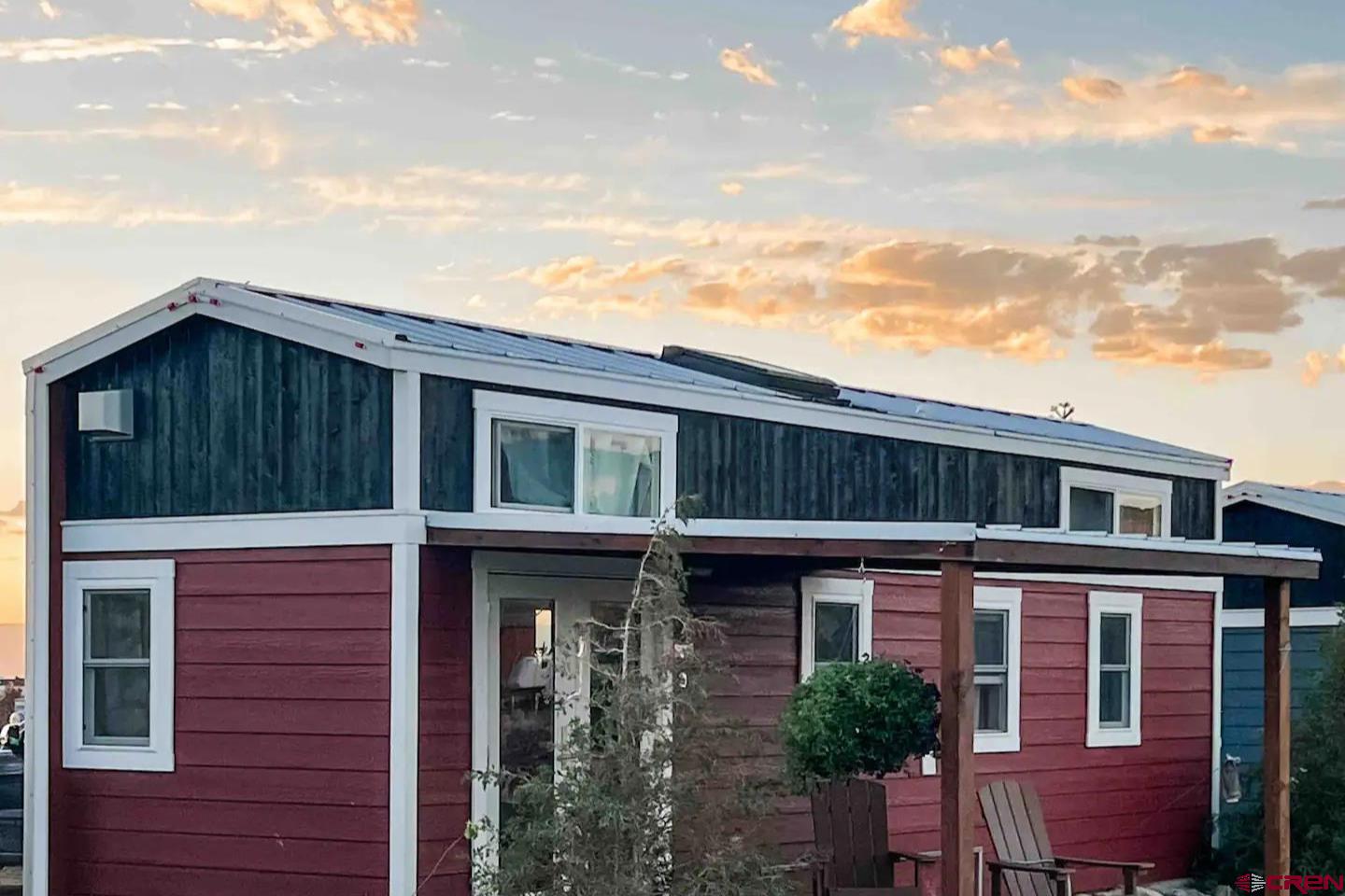 22130 6850 Road, Unit 212 Montrose, CO 81403 - Photo 19 of 29 a front view of a house with balcony