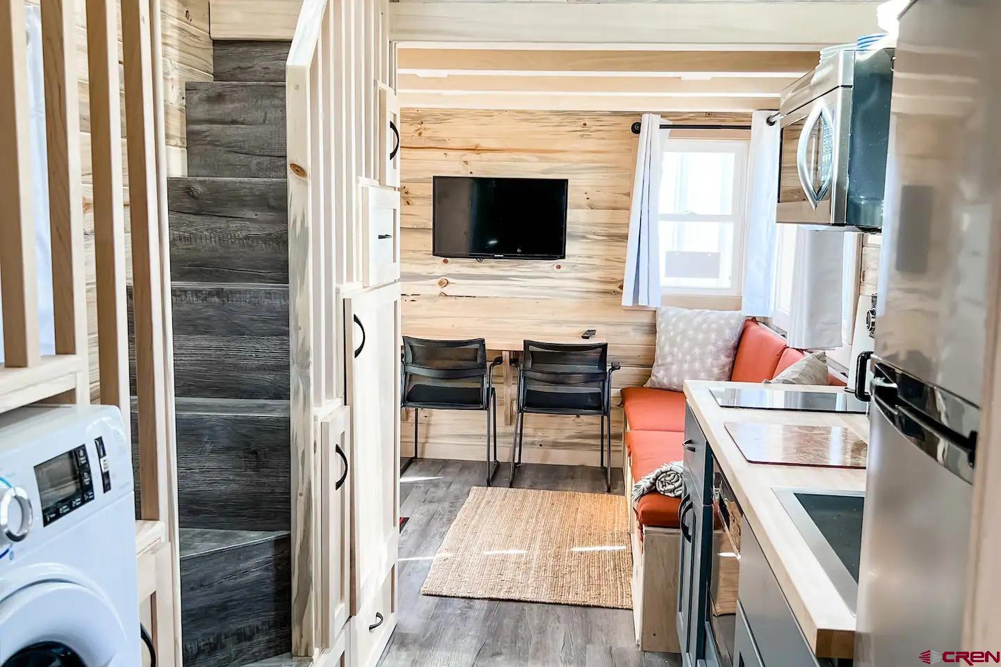 22130 6850 Road, Unit 212 Montrose, CO 81403 - Photo 7 of 29 a kitchen with a stove and a microwave