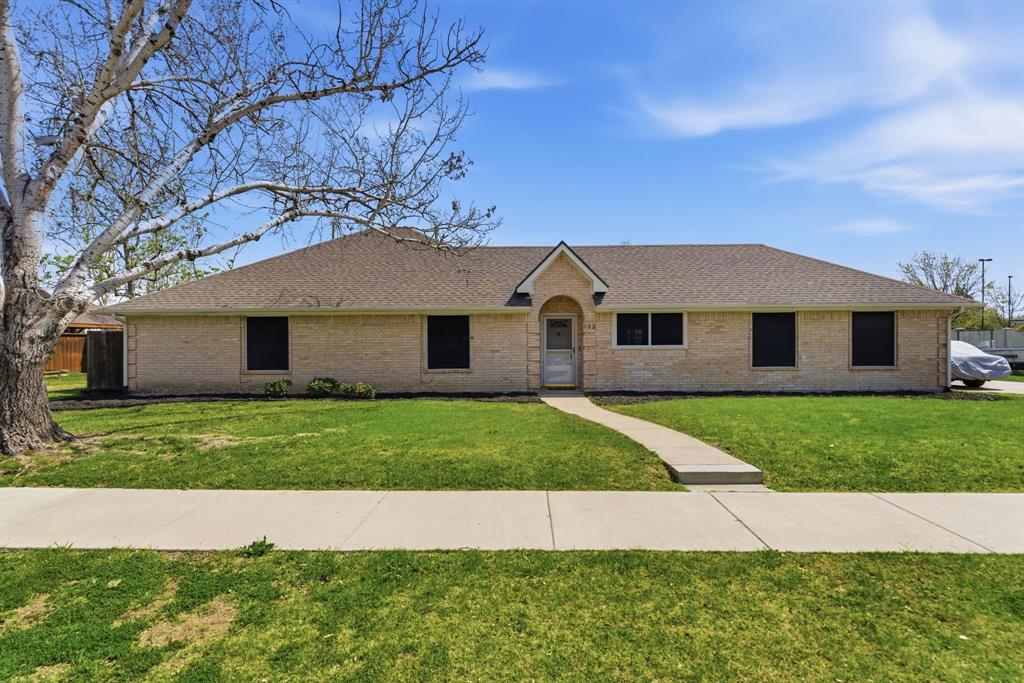 122 Button Street Little Elm, TX 75068 - Photo 1 of 1 a front view of a house with a yard and garage