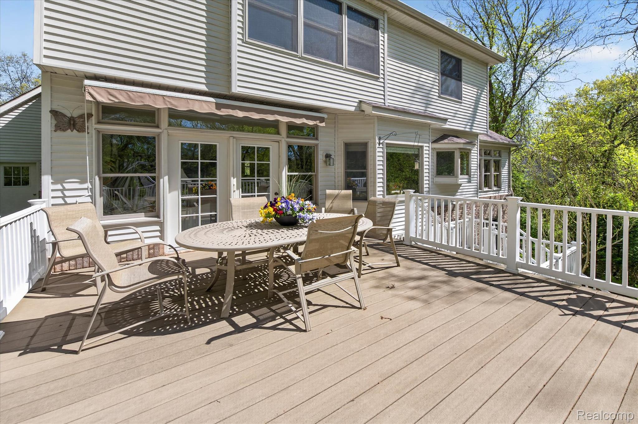 7798 Lee Road Brighton, MI 48116 - Photo 40 of 49 Wooden terrace with outdoor dining area