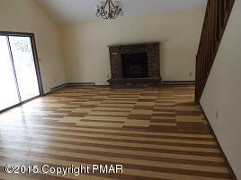 167 Magic Mountain Road Henryville, PA 18332 - Photo 3 of 7 a view of empty room with wooden floor