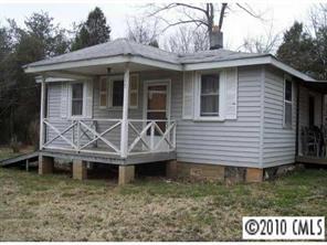 7155 Old Plank Road Stanley, NC 28164 - Photo 1 of 1 a view of brick house with large windows