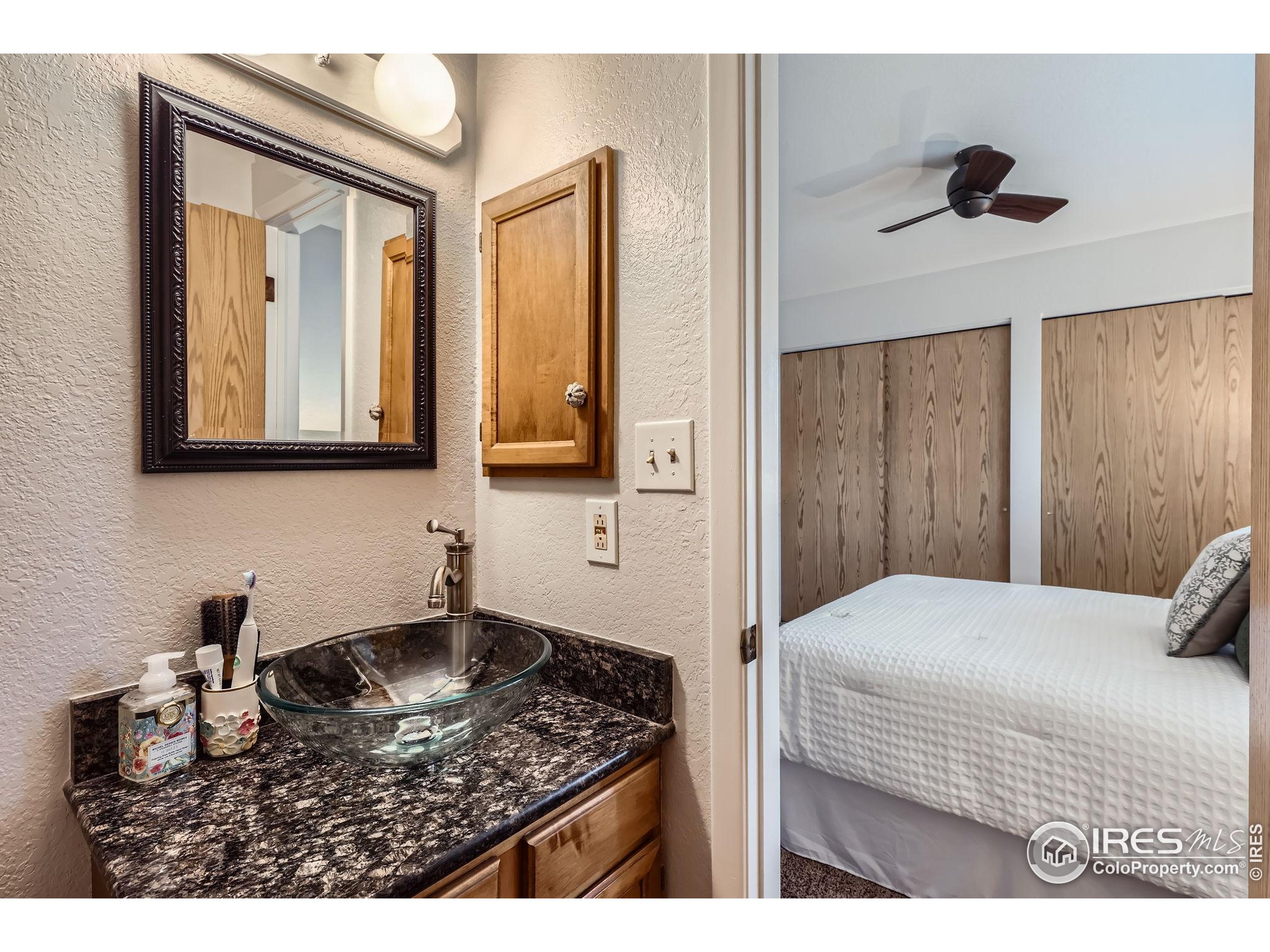 3515 28th Street, Unit 108 Boulder, CO 80301 - Photo 16 of 29 a bedroom with a bed and a dresser