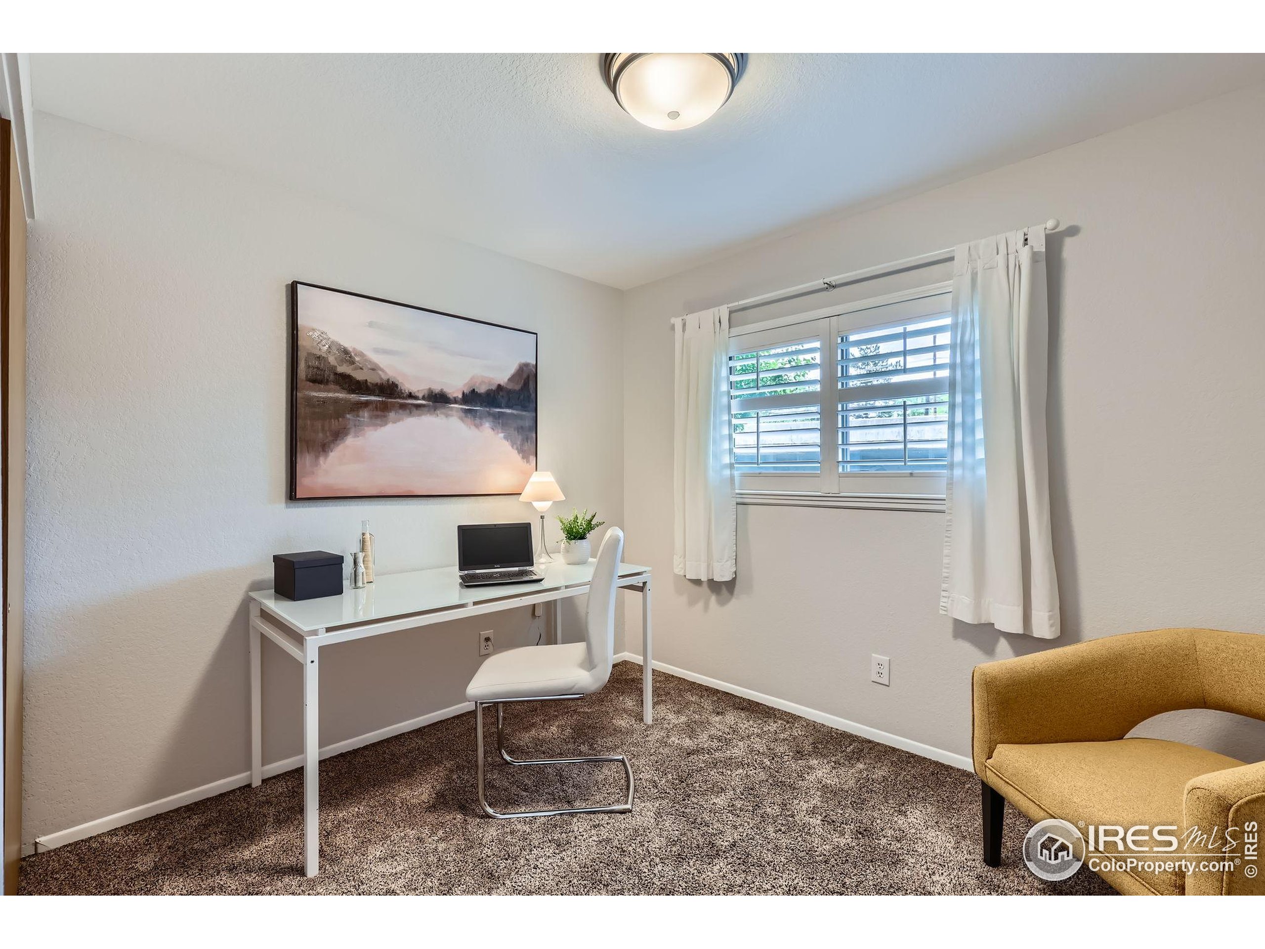 3515 28th Street, Unit 108 Boulder, CO 80301 - Photo 17 of 29 a living room with furniture and a window
