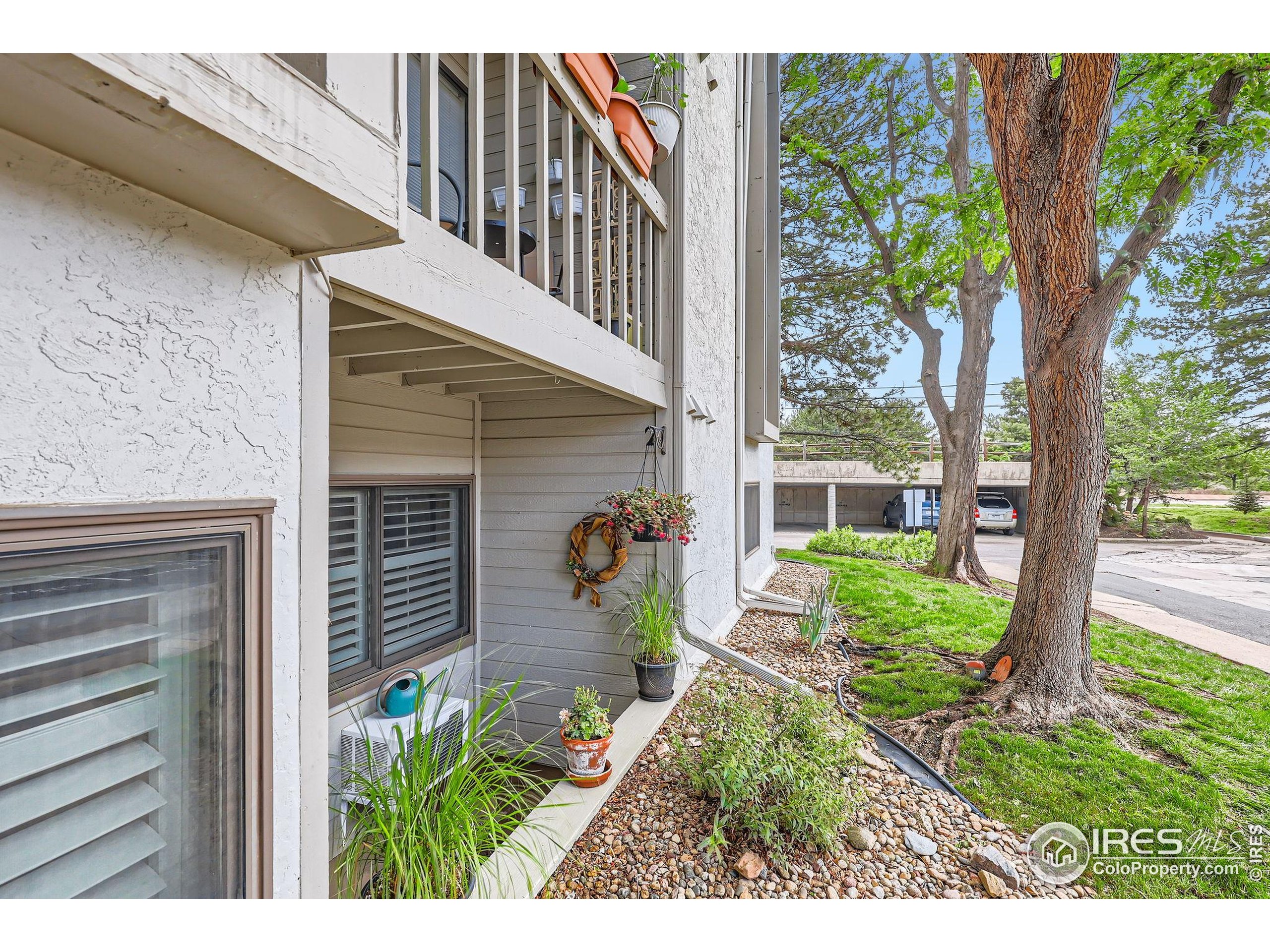 3515 28th Street, Unit 108 Boulder, CO 80301 - Photo 21 of 29 a view of a house with a flower garden