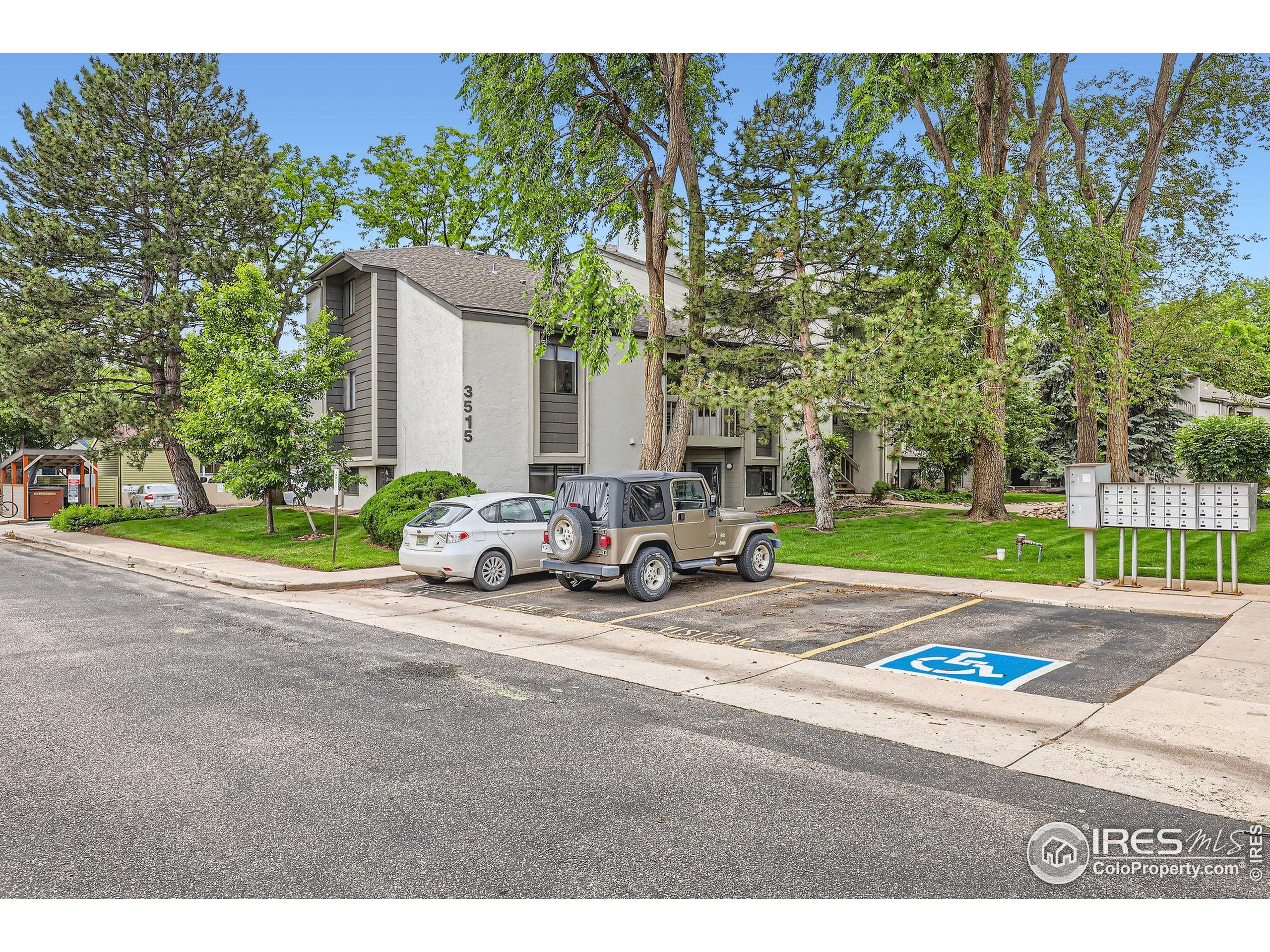 3515 28th Street, Unit 108 Boulder, CO 80301 - Photo 23 of 29 a view of a patio with a table and chairs under an umbrella