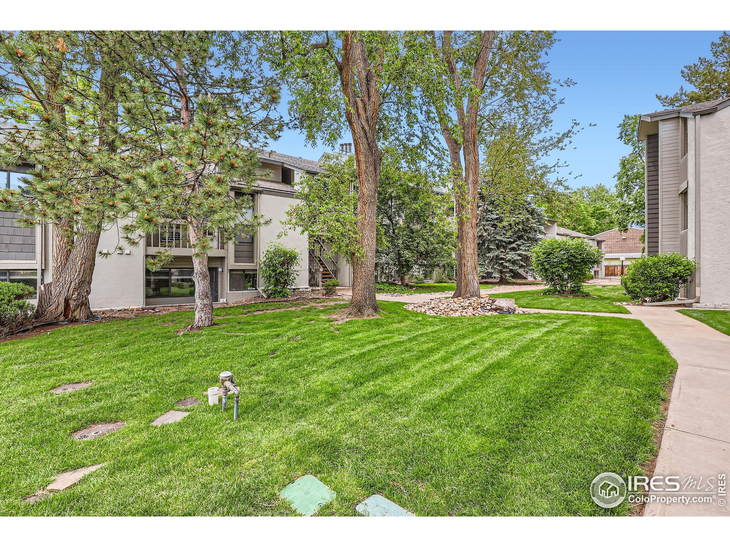 3515 28th Street, Unit 108 Boulder, CO 80301 - Photo 24 of 29 a view of a house with a backyard