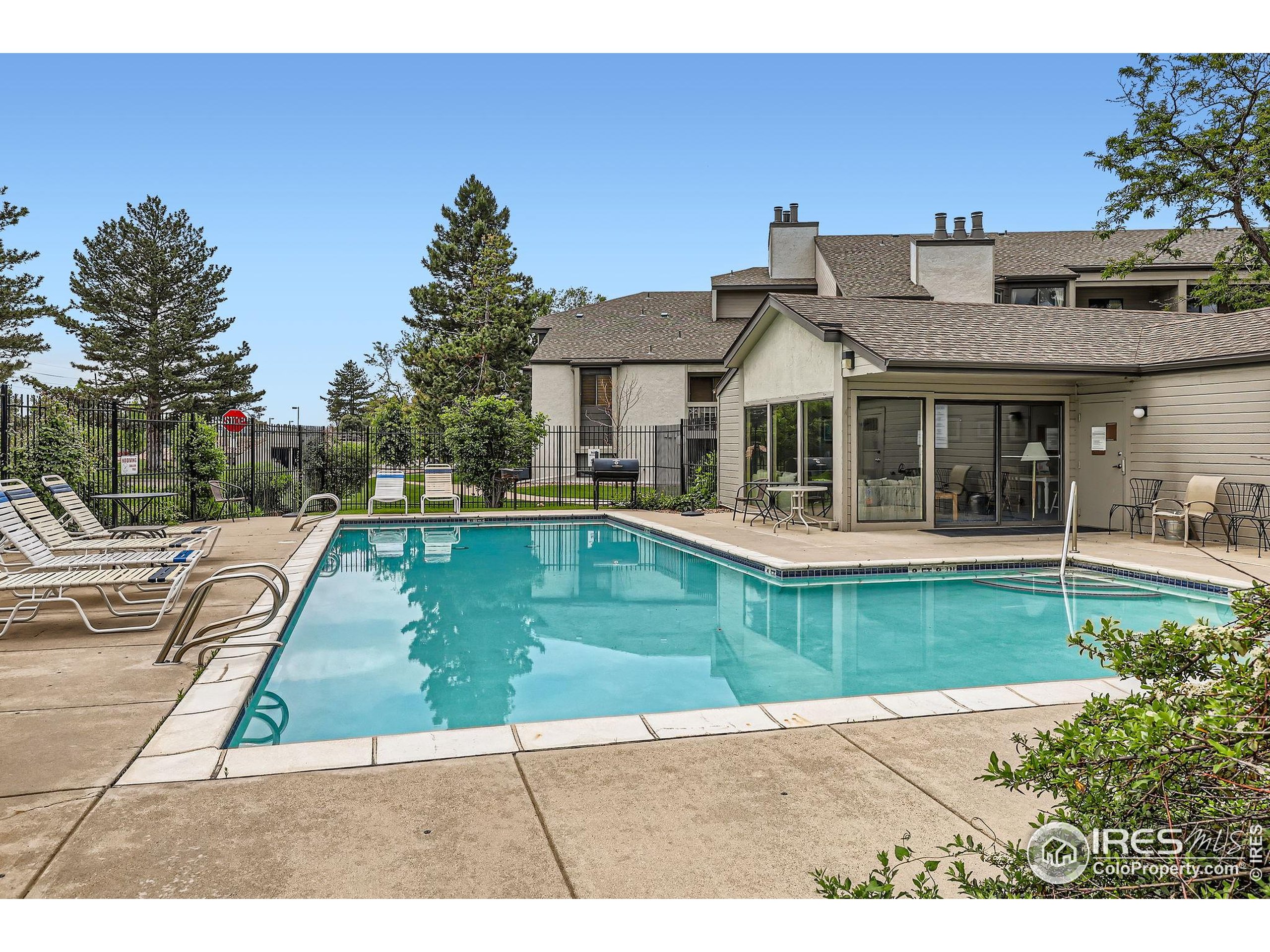3515 28th Street, Unit 108 Boulder, CO 80301 - Photo 27 of 29 a view of a house with swimming pool