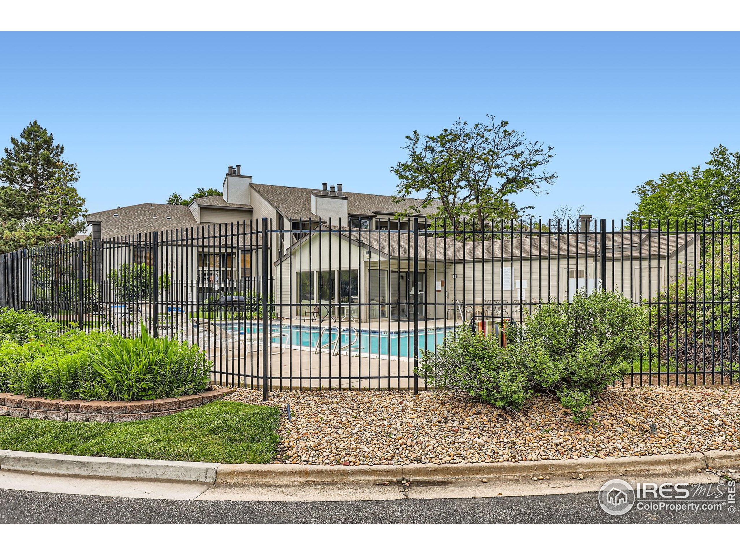 3515 28th Street, Unit 108 Boulder, CO 80301 - Photo 28 of 29 a view of a wrought iron fences in front of house
