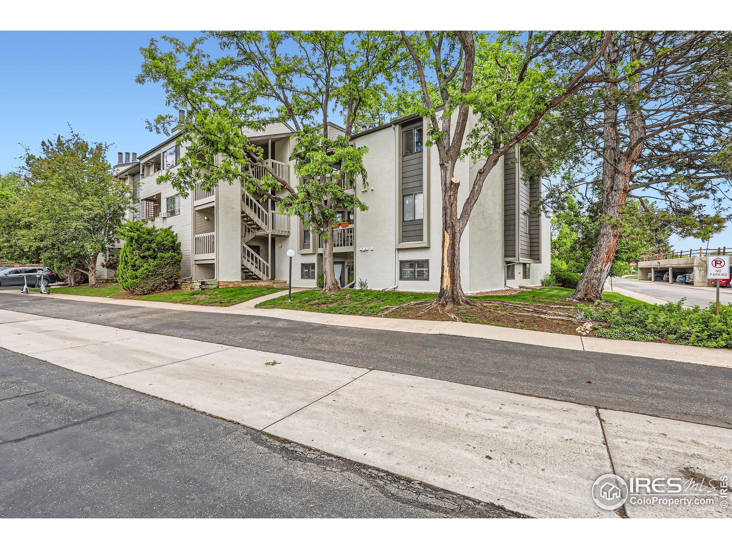 3515 28th Street, Unit 108 Boulder, CO 80301 - Photo 29 of 29 front view of a house with a street