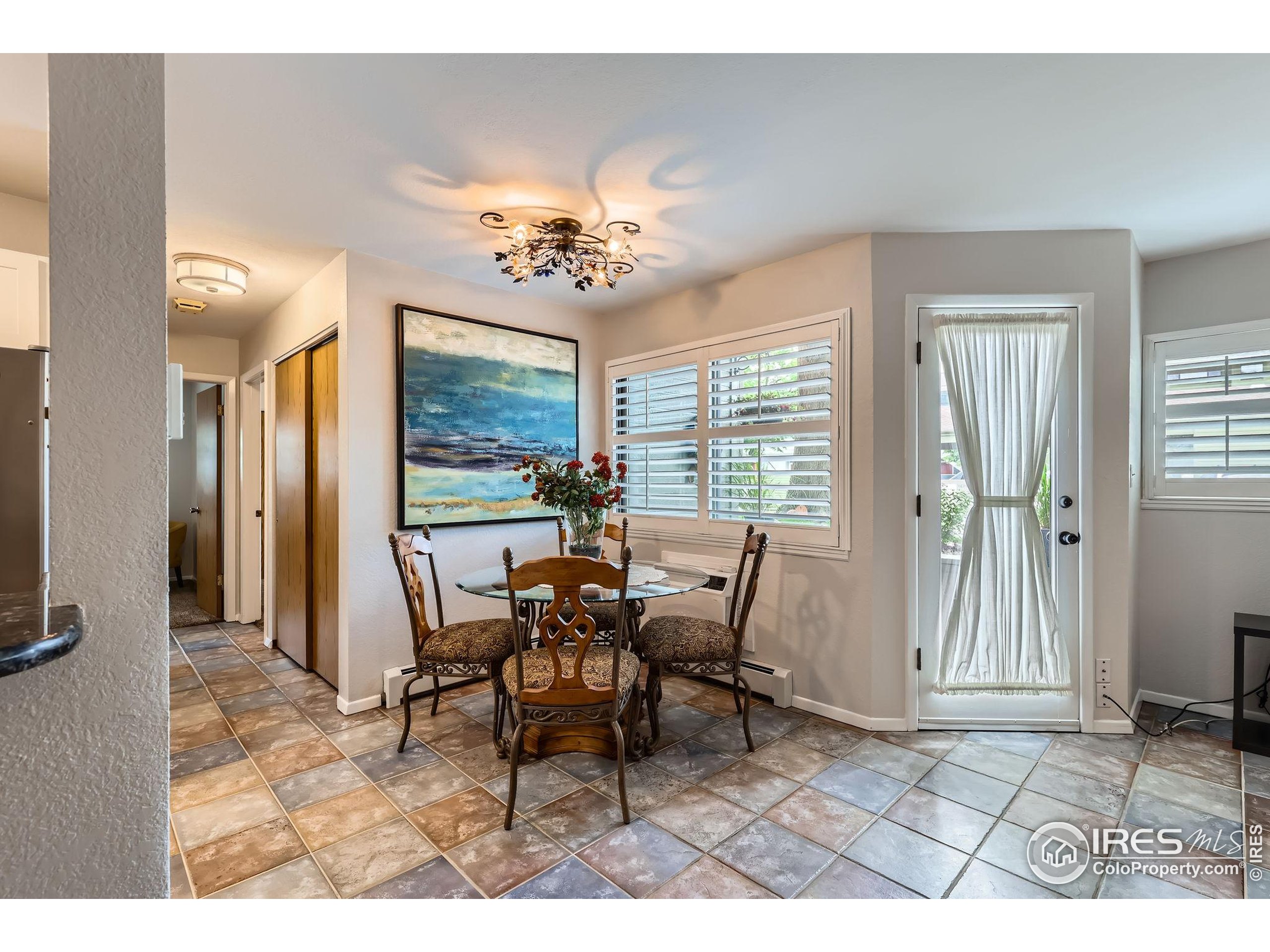 3515 28th Street, Unit 108 Boulder, CO 80301 - Photo 9 of 29 a view of a livingroom with furniture window and outside view