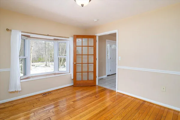 a bathroom with a bath tub and a window