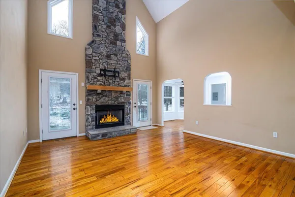 a kitchen with stainless steel appliances granite countertop a refrigerator and a stove