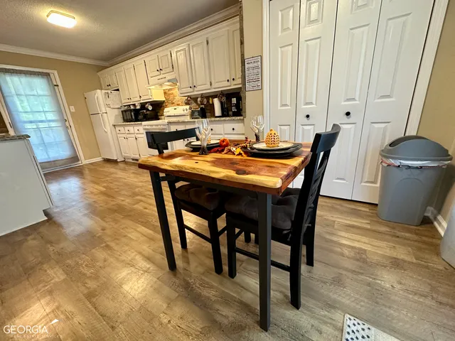 a view of a dining room with furniture