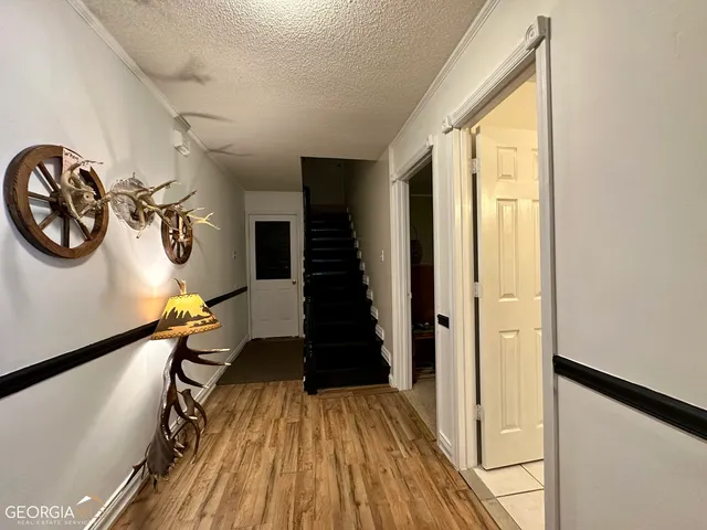 a view of entryway with wooden floor