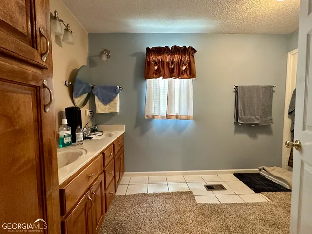 a kitchen with stainless steel appliances granite countertop a refrigerator and a stove