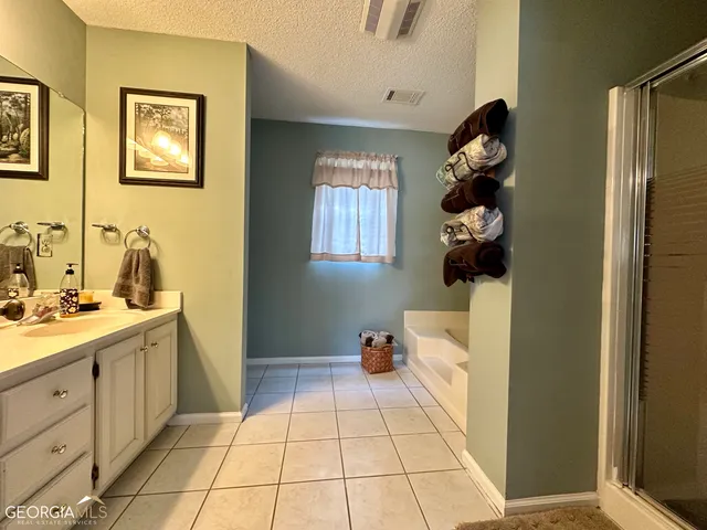 a room with a white cabinets and a window