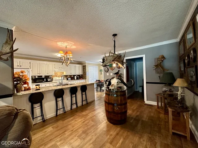 a large kitchen with lots of counter space and stainless steel appliances