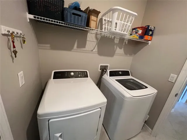 a utility room with dryer and washer