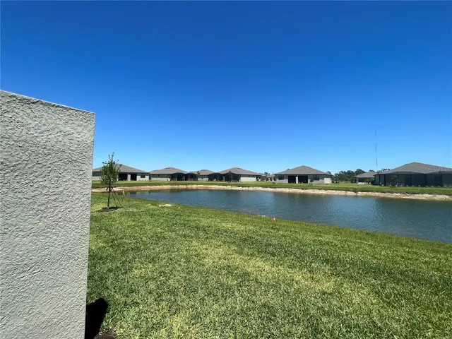 a view of lake with green space