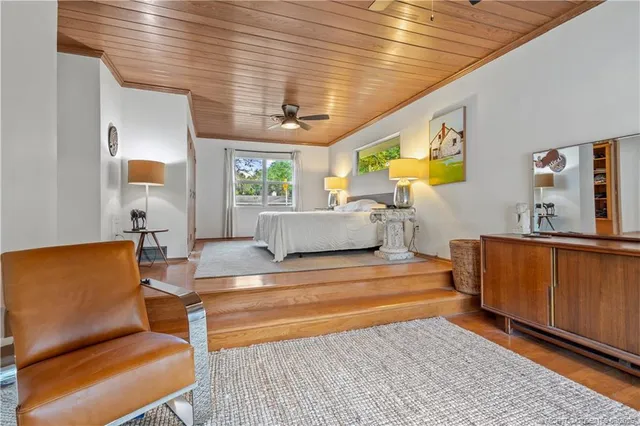 a view of a house with a yard patio and sitting area