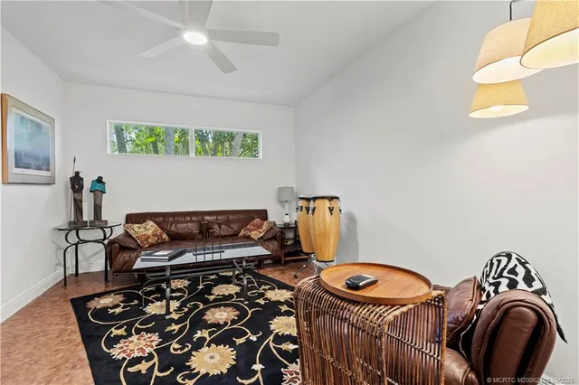 a bathroom with a sink vanity mirror and toilet