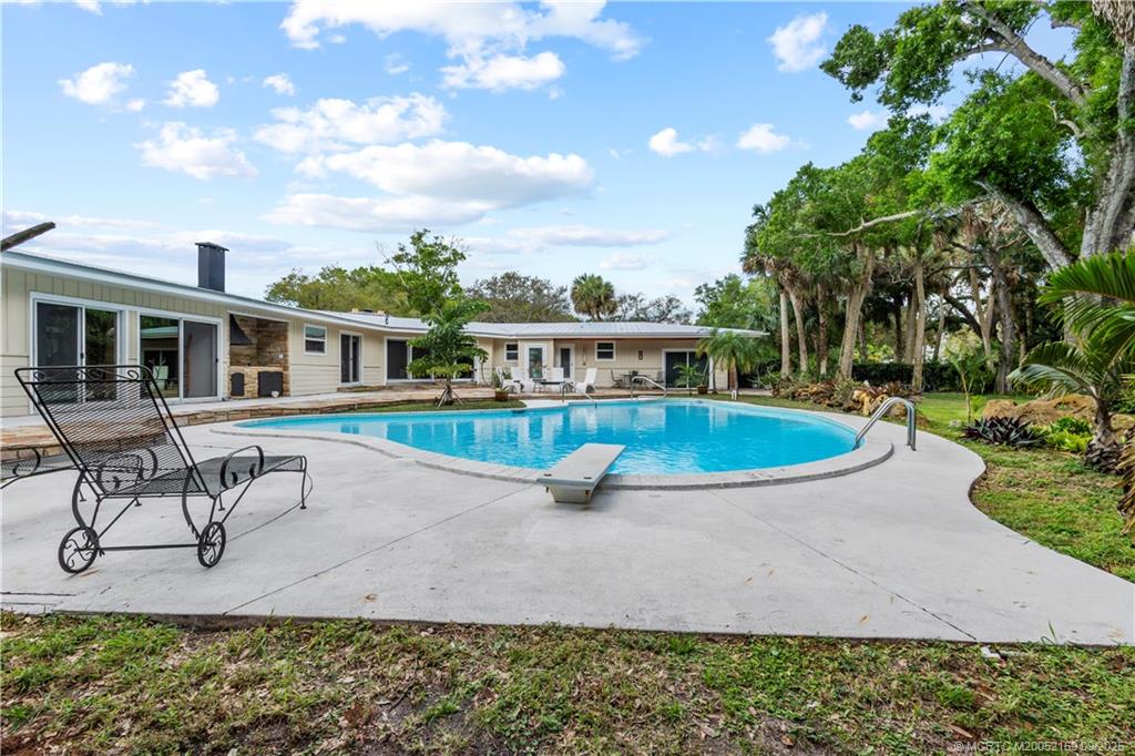 1001 South 11th Street Fort Pierce, FL 34950 - Photo 43 of 80 a view of a house with a yard patio and sitting area