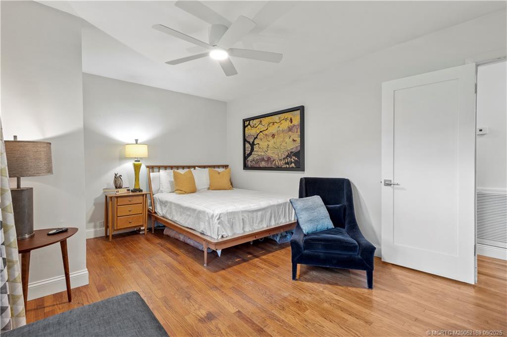 1001 South 11th Street Fort Pierce, FL 34950 - Photo 66 of 80 a bedroom with a bed a dresser and wooden floor