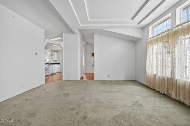 a view of empty room with windows