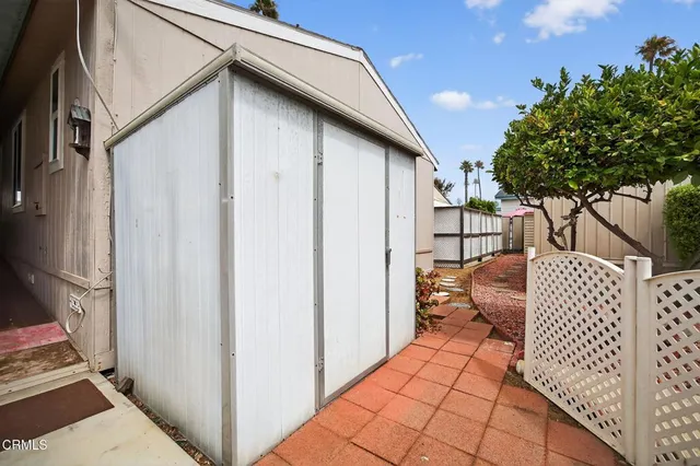 a view of a porch with wooden floor and furniture