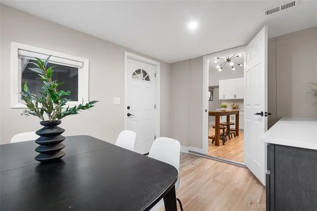 a view of a livingroom with furniture window and wooden floor