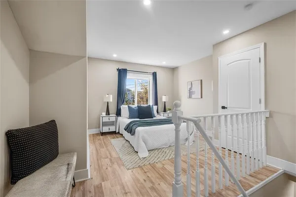 a view of a bedroom with furniture