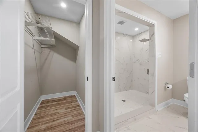 a bathroom with a bathtub and shower