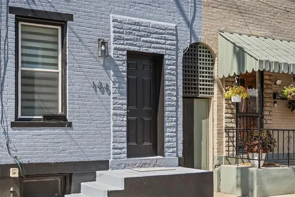 a front view of a house with parking