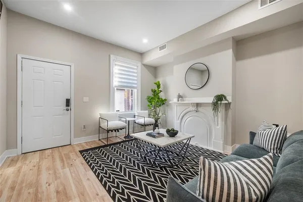 a bedroom with furniture and a window