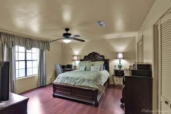 a bedroom with a bed and window