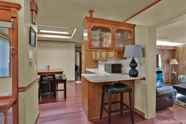 a view of a dining room with a table and chairs